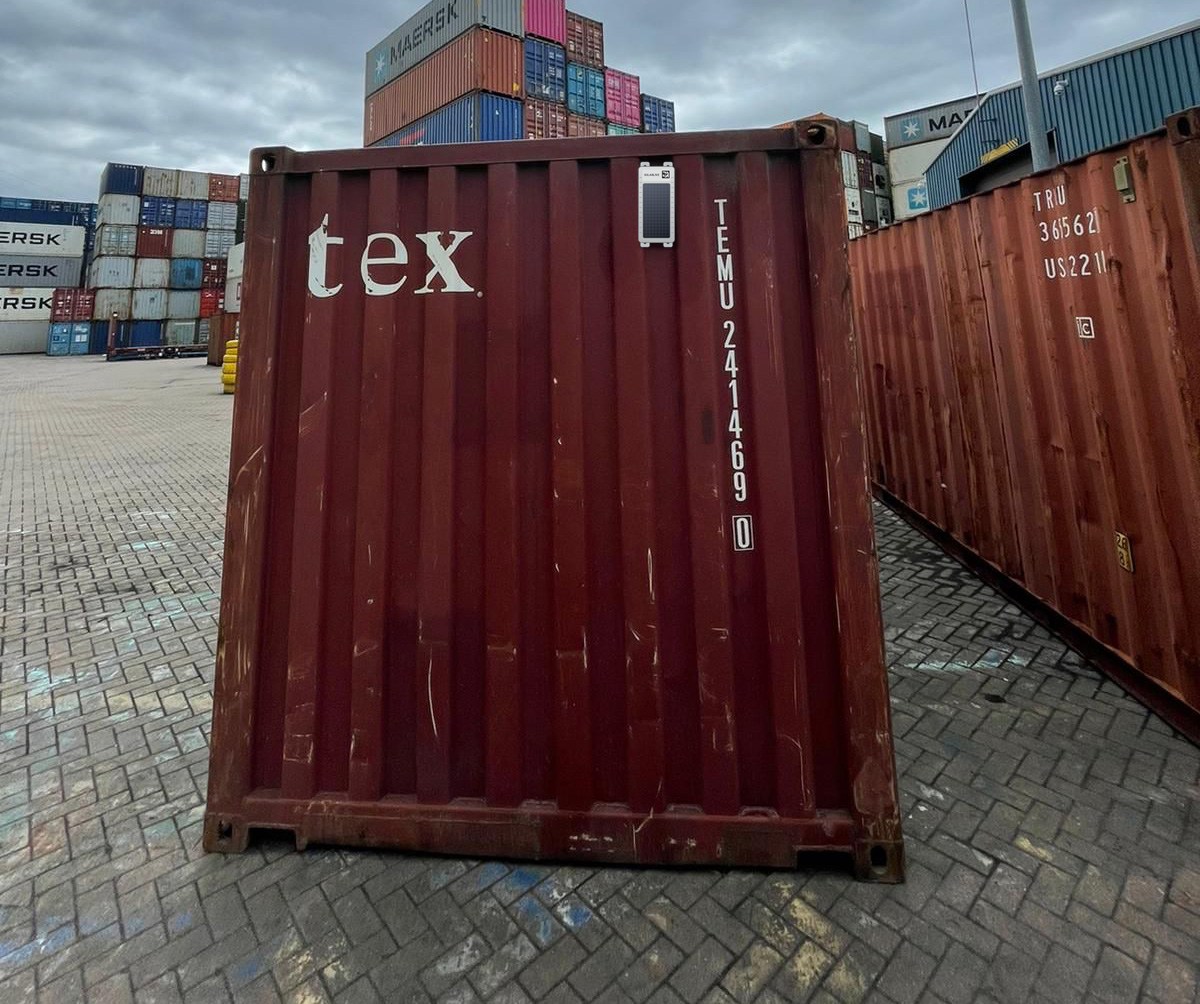 SolarLive solar-powered GPS tracker mounted on a shipping container door